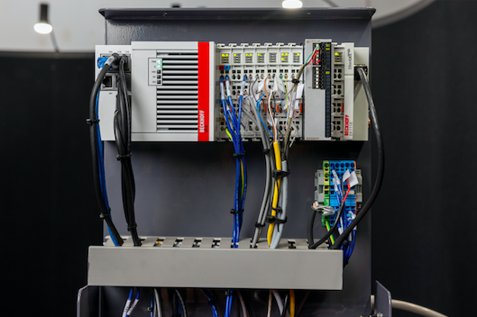 Beckhoff offered powerful control and DAQ technologies in space-saving form factors, including the DIN rail-mounted CX5130 Embedded PC (left) and ELM3502 measurement terminal (metal module on right). (© Beckhoff, 2023)