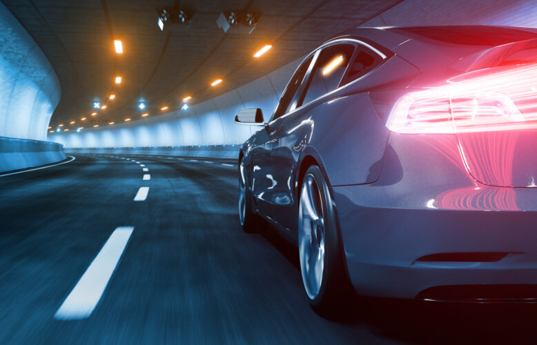 Plug-in electric vehicle with glow and motion blur and red light trails 3d rendering