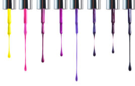 a row of paint samples dripping down a white background. Pinks and purples.